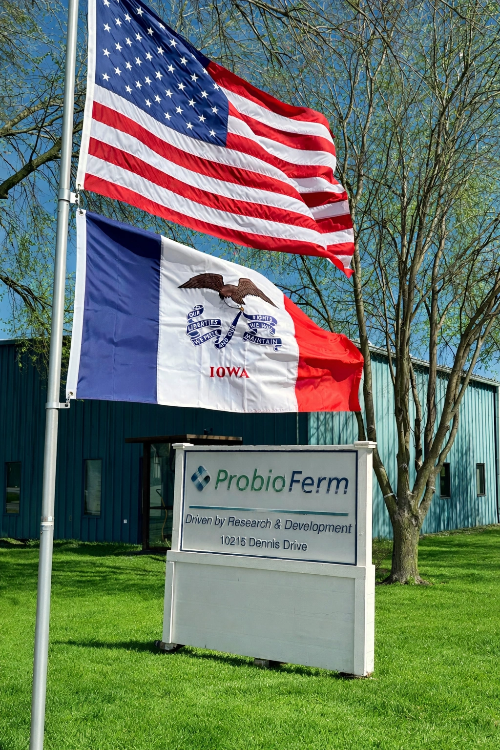 ProbioFerm facility with American and Iowa flags